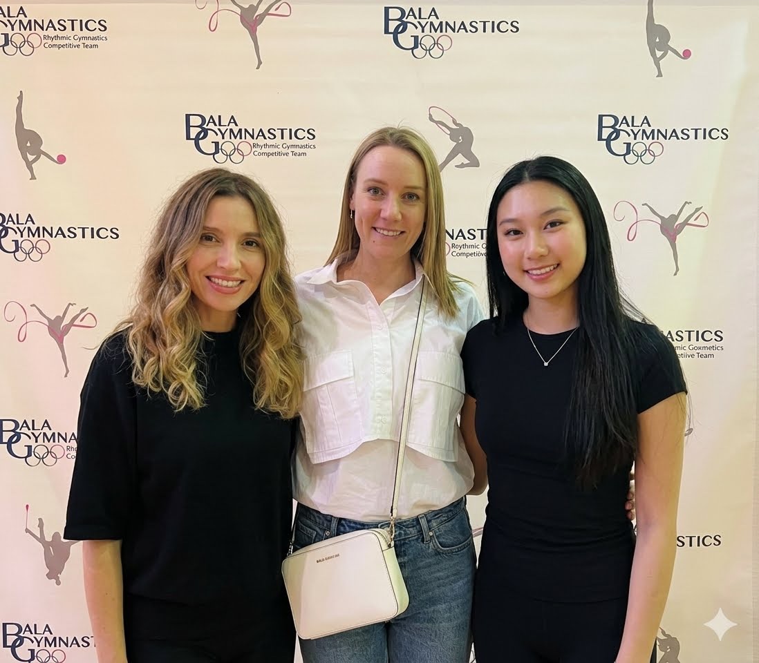 Phoenix Gymnastics NYC coaches together at a rhythmic gymnastics competition
